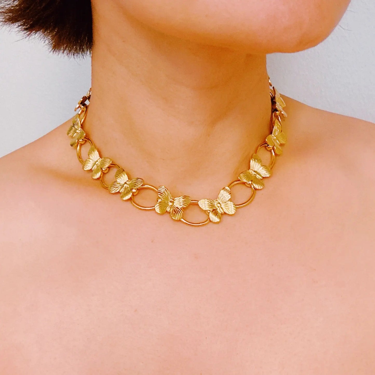 Gold Butterfly Link Choker Necklace on Model